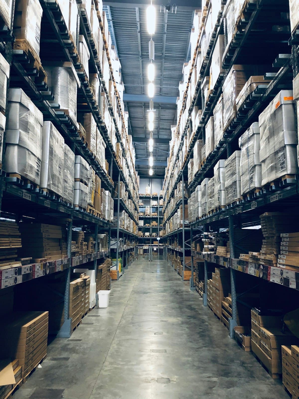 Organized warehouse racks stacked with inventory boxes